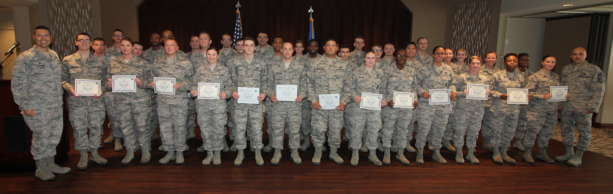 Col. Thomas Sherman, 88th Air Base Wing and installation commander, (left), and Chief Master Sgt. Stephen Arbona, 88th Air Base Wing command chief (right), congratulated the newest Team Wright-Patt enlisted promotees during a ceremony at the Wright-Patt Club, Wright-Patterson Air Force Base, Ohio, Aug 30, 2018. (U.S. Air Force Photo/Thomas Lewis)