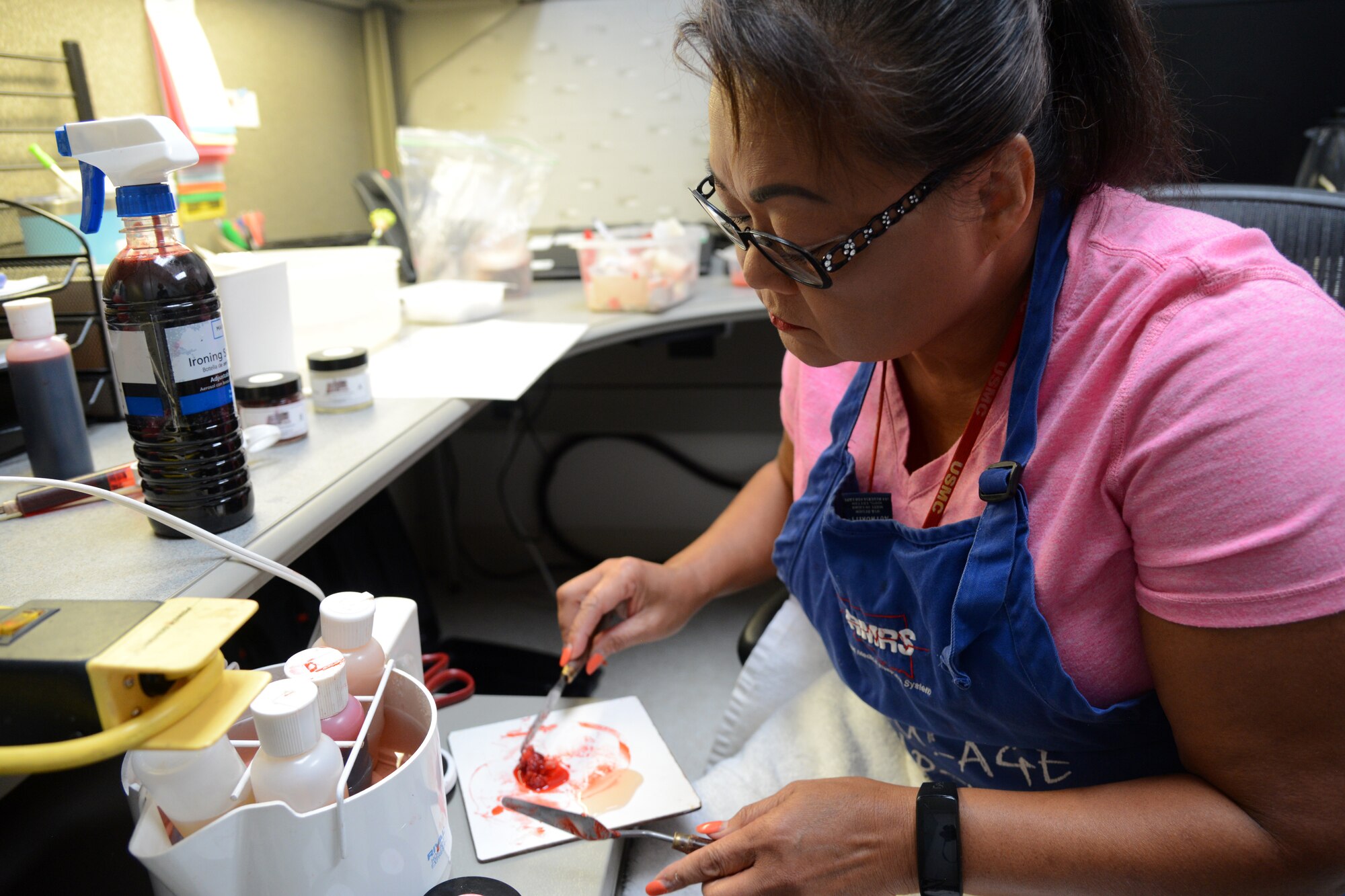 Sunny Schones prepares moulage for an active shooter training Aug.15 in Bldg. 1094 at Tinker Air Force Base.