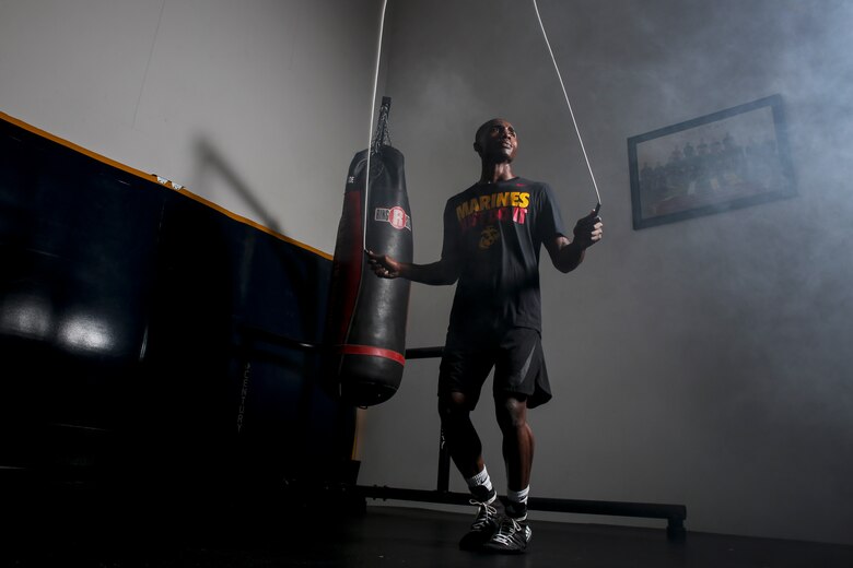 Cpl. Oubigee Jones stands in the gym where he trains nearly every day aboard Marine Corps Air Station Beaufort, Aug. 30. Jones began fighting when he was eight years old. “I grew up in the streets of south Dallas, the hood basically. Everyone started fighting at a young age, whether it be to defend themselves or to earn their stripes.” Jones is an administrative specialist with Headquarters and Headquarters Squadron.