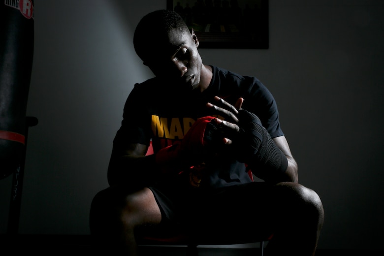 Cpl. Oubigee Jones stands in the gym where he trains nearly every day aboard Marine Corps Air Station Beaufort, Aug. 30. Jones began fighting when he was eight years old. “I grew up in the streets of south Dallas, the hood basically. Everyone started fighting at a young age, whether it be to defend themselves or to earn their stripes.” Jones is an administrative specialist with Headquarters and Headquarters Squadron.
