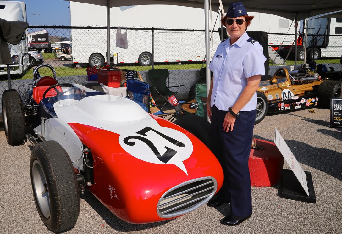 As part of a community outreach event, the 932nd Airlift Wing Maintenance Group commander, Col. Sharon Johnson, got a backstage view with amazing racing cars.  She was recognized on the big stage in front of the entire stadium with the entire lineup of Indy drivers at the Bommarito Automotive Group 500 Aug. 25, 2018, Gateway Motorsports Park, Madison, Illinois. Here she was shown the "pit row" vintage racers before attending a driver's meeting.  Johnson was an honored VIP to help kick off the 2nd annual IndyCar race which was won by Will Power,  won the 248-lap race around the four-turn, 1.25-mile Gateway Motorsports Park oval paved track in Madison, Illinois, in his #12 Chevrolet by 1.3117 seconds over second place finisher Alexander Rossi.  The 932nd Airlift Wing was represented by maintenance, medical, public affairs staff and operations personnel.  (U.S. Air Force photo by Lt. Col. Stan Paregien)