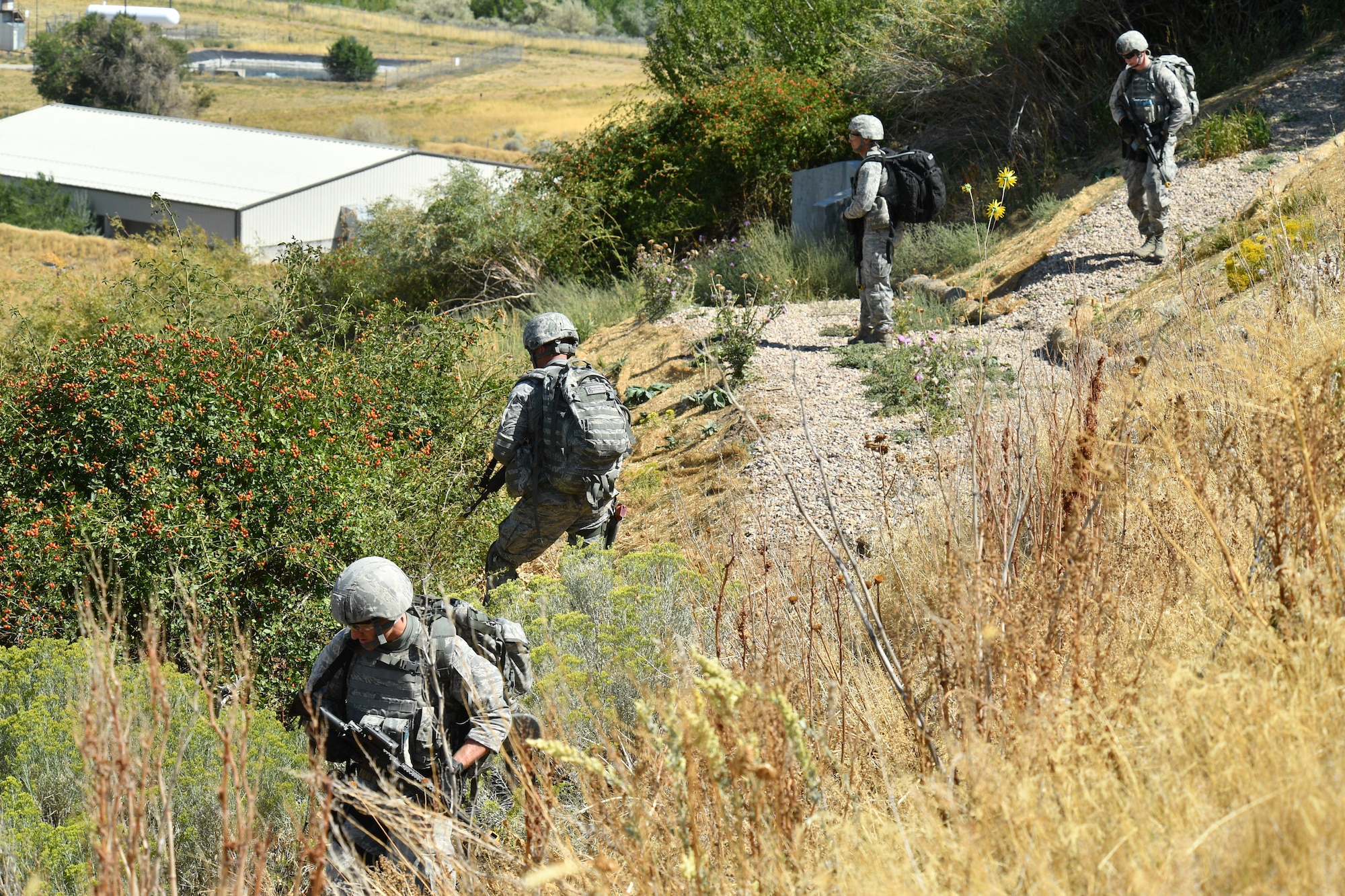 Security forces defenders during a training patrol Sept. 7, 2018, at Hill Air Force Base, Utah. A total of six Airmen were selected from across Air Force Material Command to represent the command at the 2018 Defender Challenge Sept. 10-14 at Camp Bullis Military Training Reservation, near San Antonio, Texas. The team will compete against 13 other teams from other U.S. Air Force major commands, Great Britain and Germany in the first 2018 Defender Challenge since 2004. (U.S. Air Force photo by R. Nial Bradshaw)