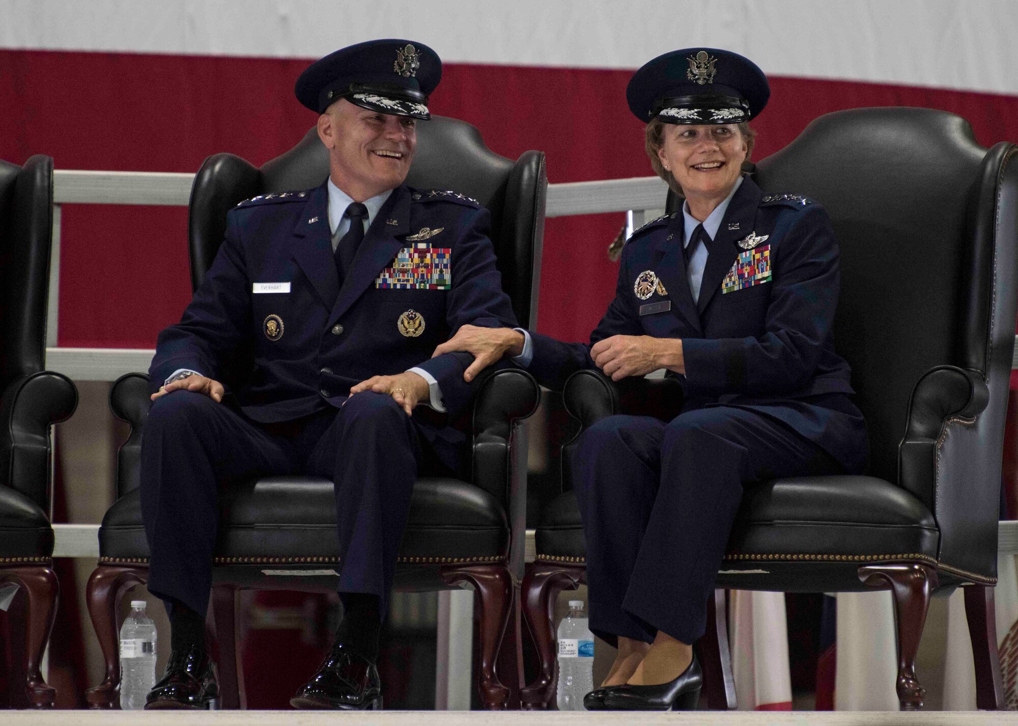 Gen. Carlton D. Everhart II, outgoing Air Mobility Command commander, and Gen. Maryanne Miller, incoming AMC commander, share a moment during the AMC change of command, Scott Air Force Base, Illinois, Sept. 7, 2018. Miller assumed command from Everhart, who retires after 35 years of service to the Air Force. AMC provides rapid, global mobility and sustainment for America's armed forces through airlift, aerial refueling, aeromedical evacuation and mobility support. (U.S. Air Force photo by Tech. Sgt. Jodi Martinez)