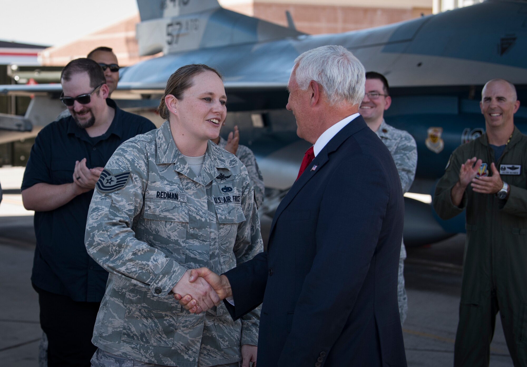 Vice President Mike Pence congratulates Tech. Sgt. Vanessa Redman, 32nd Weapons Squadron NCO in charge, on her Stripes for Exceptional Performers (STEP) promotion moments prior at Nellis Air Force Base, Nevada, Sept. 7, 2018. Pence and Brig. Gen. Robert Novotny, 57th Wing commander, surprised her with the promotion during Pence’s visit. (U.S. Air Force photo by Airman 1st Class Andrew D. Sarver)