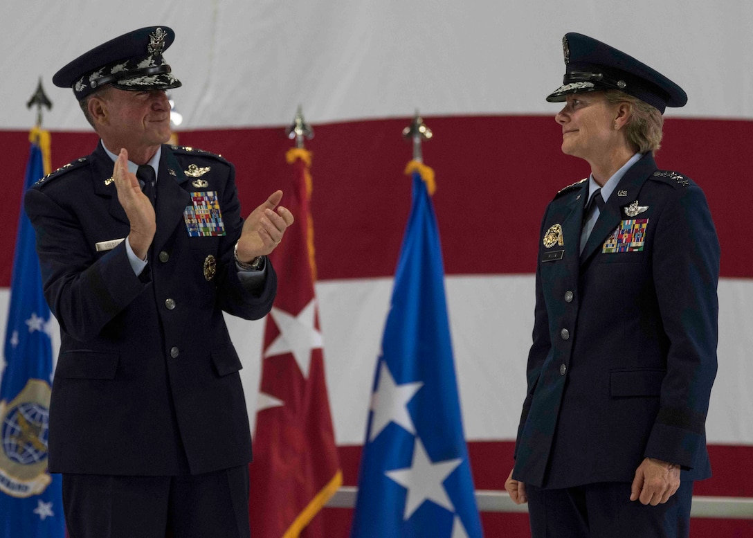 Air Force Chief of Staff Gen. David L. Goldfein claps for Gen. Maryanne Miller after she assumed command of Air Mobility Command, Scott Air Force Base, Illinois, Sept. 7, 2018. Miller assumed command from Gen. Carlton D. Everhart II, who retires after 35 years of service to the Air Force. AMC provides rapid global air mobility and sustainment for America's armed forces through airlift, aerial refueling, aeromedical evacuation and mobility support.  (U.S. Air Force photo by Tech. Sgt. Jodi Martinez)