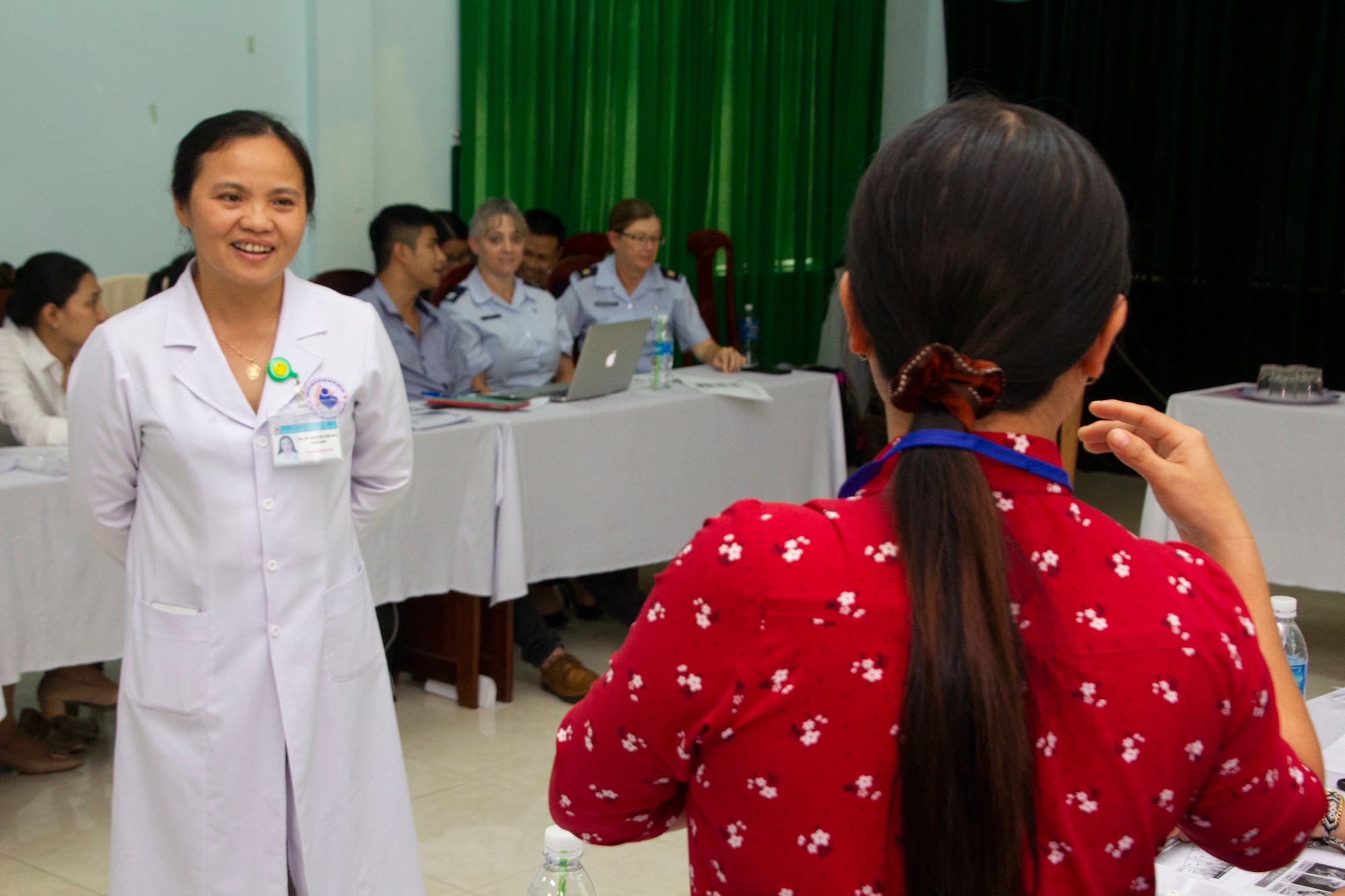 Dr. Nha Thi Nguyen, director of Quang Nam Department of Health, Reproductive Health Care Center, left, takes a question as part of a women and infant health discussion with Vietnamese and U.S. health care professionals during a Pacific Angel 2018 (PACANGEL 18-2) subject matter expert exchange Sept. 6, 2018, in Tam Ky, Quang Nam province, Vietnam.
