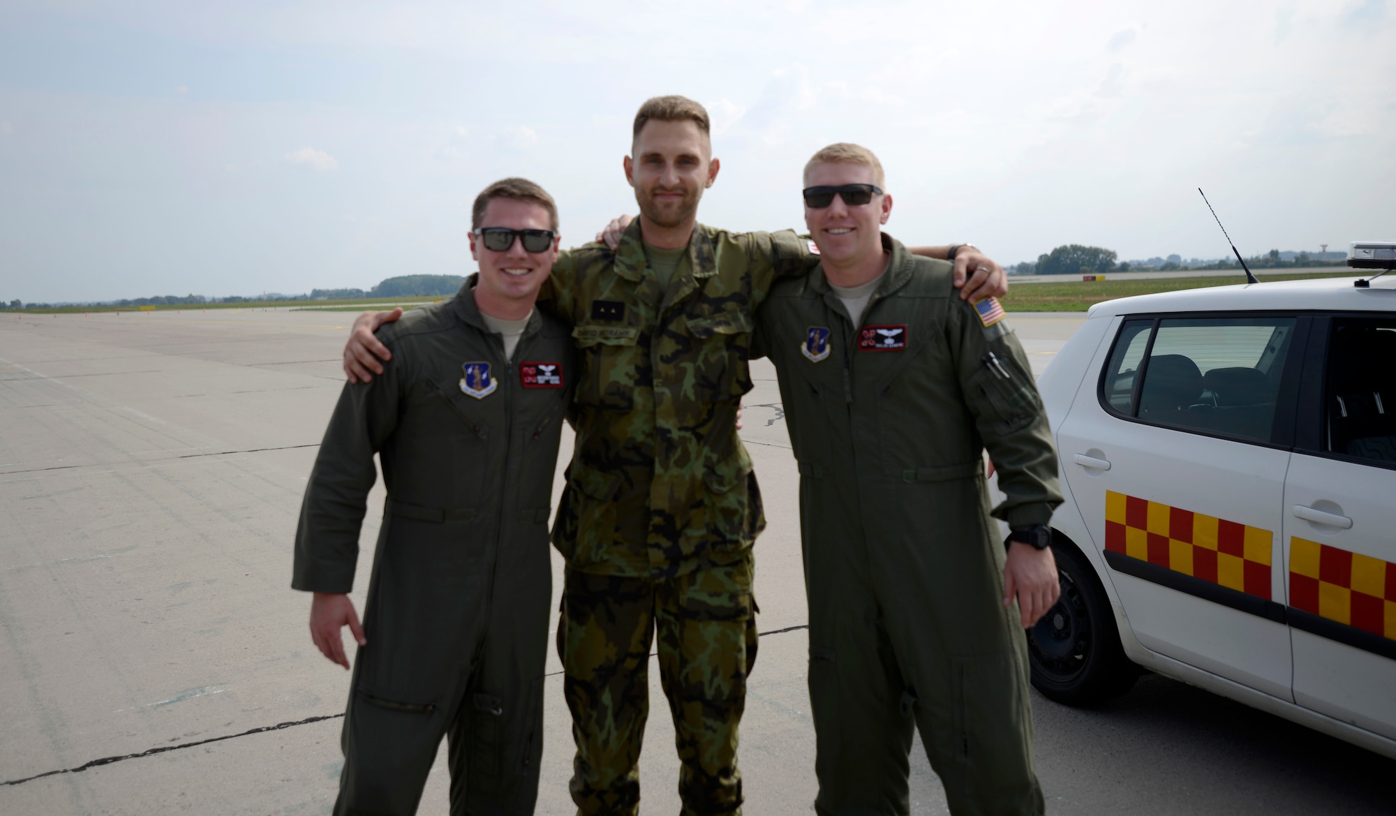 1st Lt. Taylor Ashmore, 155th Air Refueling Wing, Nebraska Air National Guard mission pilot, and Staff Sgt. Matthew Parker, 155th ARW in-flight refueling specialist, stand with a grounds service technician assigned to Pardubice Air Base, Czech Republic, after a refueling flight during a joint training exercise in the Pardubice Region. This year the State of Nebraska, and the State of Texas, are celebrating the 25th year of their partnership with the Czech Republic through the State Partnership Program (SPP). The ANG has 73 partnerships around the world to promote access, enhance military capabilities, improve interoperability, and enhance the principles of responsible governance. (U.S. Air National Guard photo by Tech. Sgt. Rana Franklin)