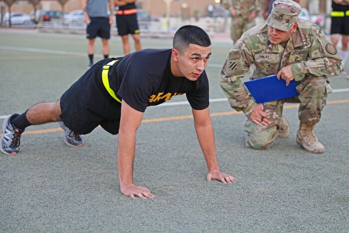 A soldier performs a pushup.