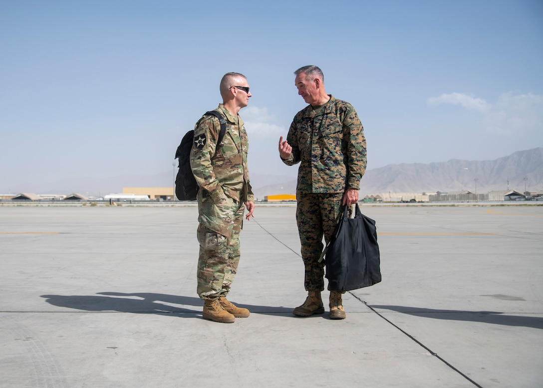 Joint Chiefs chairman and senior enlisted advisor talk on Bargram Airfield flight line.