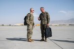 Joint Chiefs chairman and senior enlisted advisor talk on Bargram Airfield flight line.