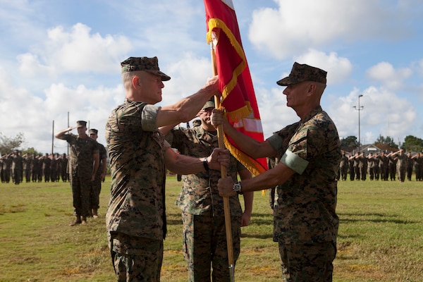Maj. Gen. Burke W. Whitman, left, incoming commander of Marine Forces Reserve and Marine Forces North receives the MARFORRES colors from Lt. Gen. Rex C. McMillian, outgoing commander of MARFORRES and MARFORNORTH during the change of command ceremony Sept. 8, 2018, at Marine Corps Support Facility New Orleans. McMillian served as the commander from 2015-2018. (U.S. Marine Corps photo by Lance Cpl. Tessa D. Watts)