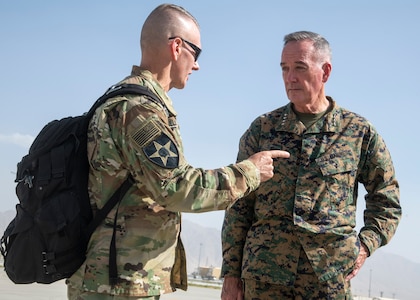 Marine Corps Gen. Joe Dunford, chairman of the Joint Chiefs of Staff, speaks with Army Command Sgt. Maj. John W. Troxell, senior enlisted advisor to the chairman on the Joint Chiefs of Staff at Bagram Airfield, Sept. 7, 2018.