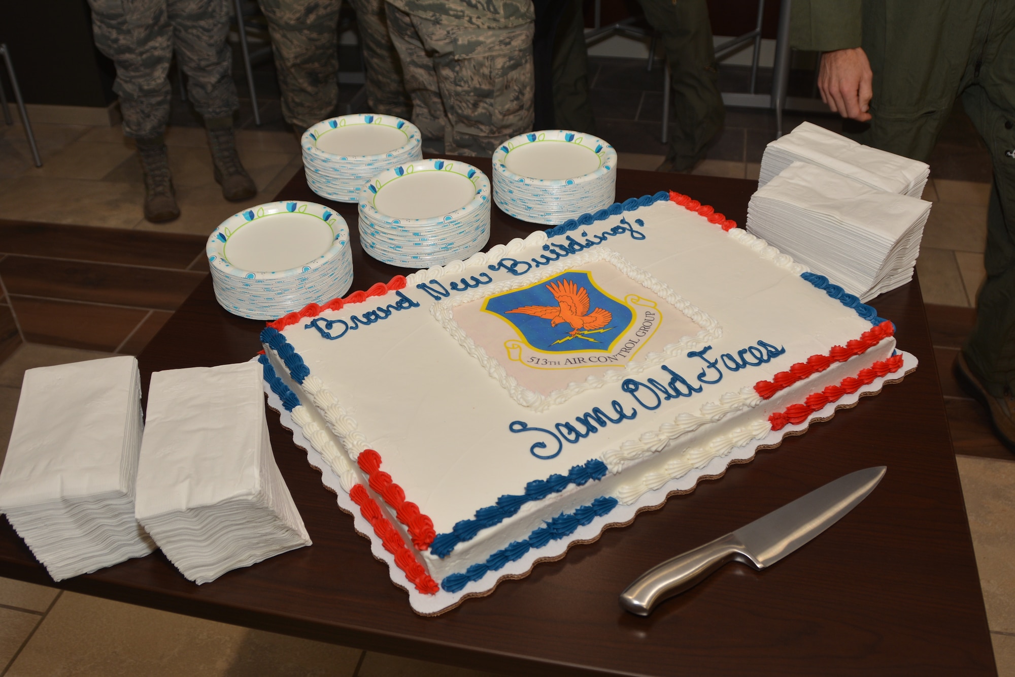 Members of the 513th Air Control Group gather at a ribbon-cutting ceremony with refreshments Sept. 7, 2018, at Tinker Air Force Base, Oklahoma. The 513th Air Control Group is the only Air Force Reserve unit to fly and maintain the E-3 Sentry, an Airborne Warning and Control System aircraft that provides surveillance, warning and tactical control of U.S. and allied military aircraft. As a Reserve Associate Unit, 513th ACG Airmen assigned work hand-in-hand with the active-duty 552nd Air Control Wing, contributing reliable AWACS support to numerous missions worldwide regularly. (Air Force photo by Master Sgt. Grady Epperly)