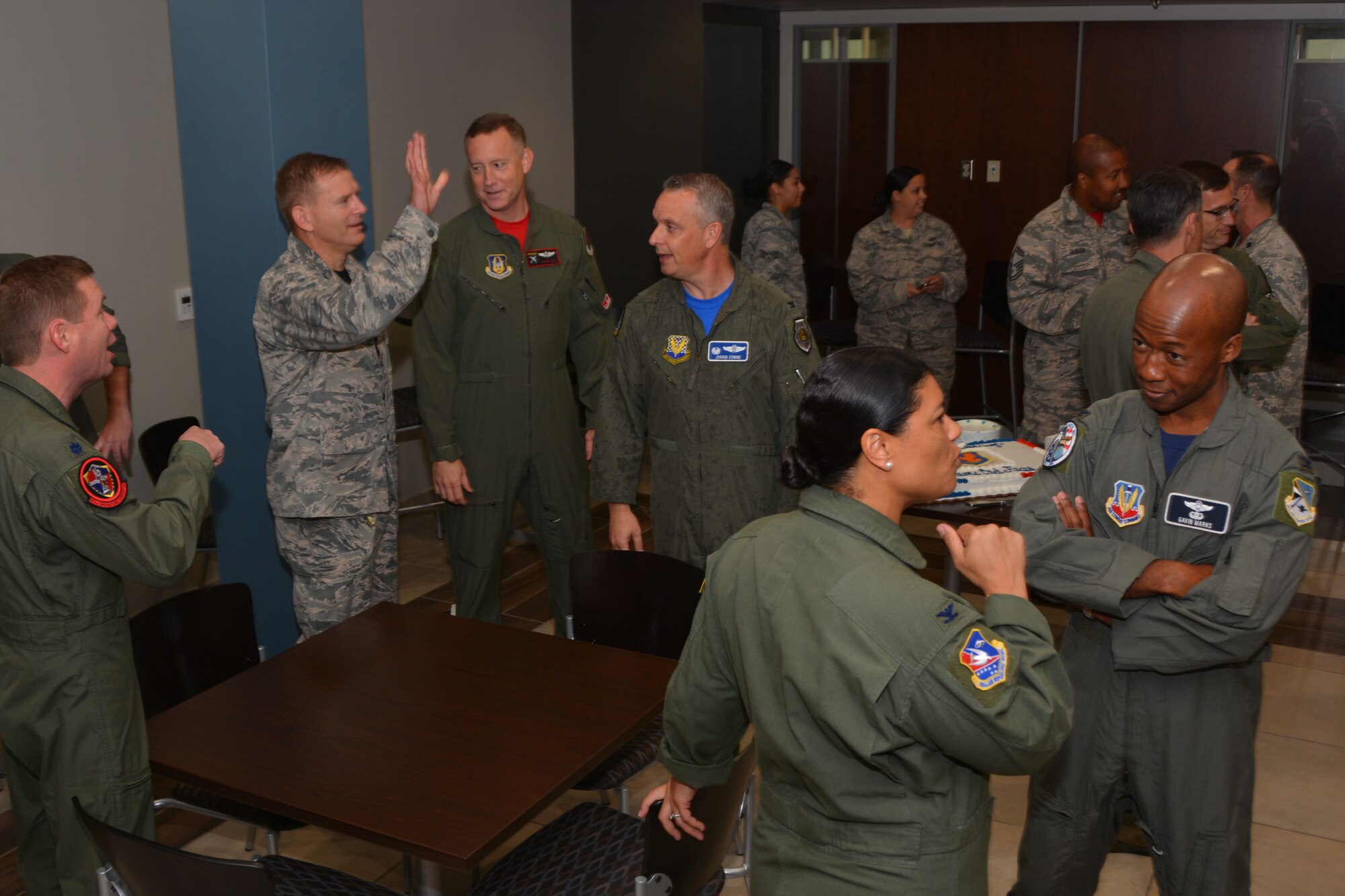 Active-duty and Reserve leadership from across the Tinker Air Force Base community share stories and jokes prior to the big event Sept. 7, 2018. The 513th Air Control Group is the only Air Force Reserve unit to fly and maintain the E-3 Sentry, an Airborne Warning and Control System aircraft that provides surveillance, warning and tactical control of U.S. and allied military aircraft. As a Reserve Associate Unit, ACG Airmen assigned work hand-in-hand with the active-duty 552nd Air Control Wing, contributing reliable AWACS support to numerous missions worldwide regularly. (Air Force photo by Master Sgt. Grady Epperly)