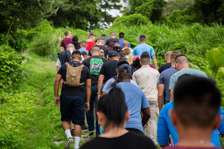 Marines and Sailors hike up Hacksaw Ridge, Okinawa, Japan, Sept. 7, 2018. Marines and Sailors with Headquarters Company, Headquarters Regiment, 3rd Marine Logistics Group, participated in the World War II battle site tour to learn about the U.S. Marine Corps’ history on Okinawa and remember those who have gone before them. (U.S. Marine Corps photo by Pfc. Terry Wong)