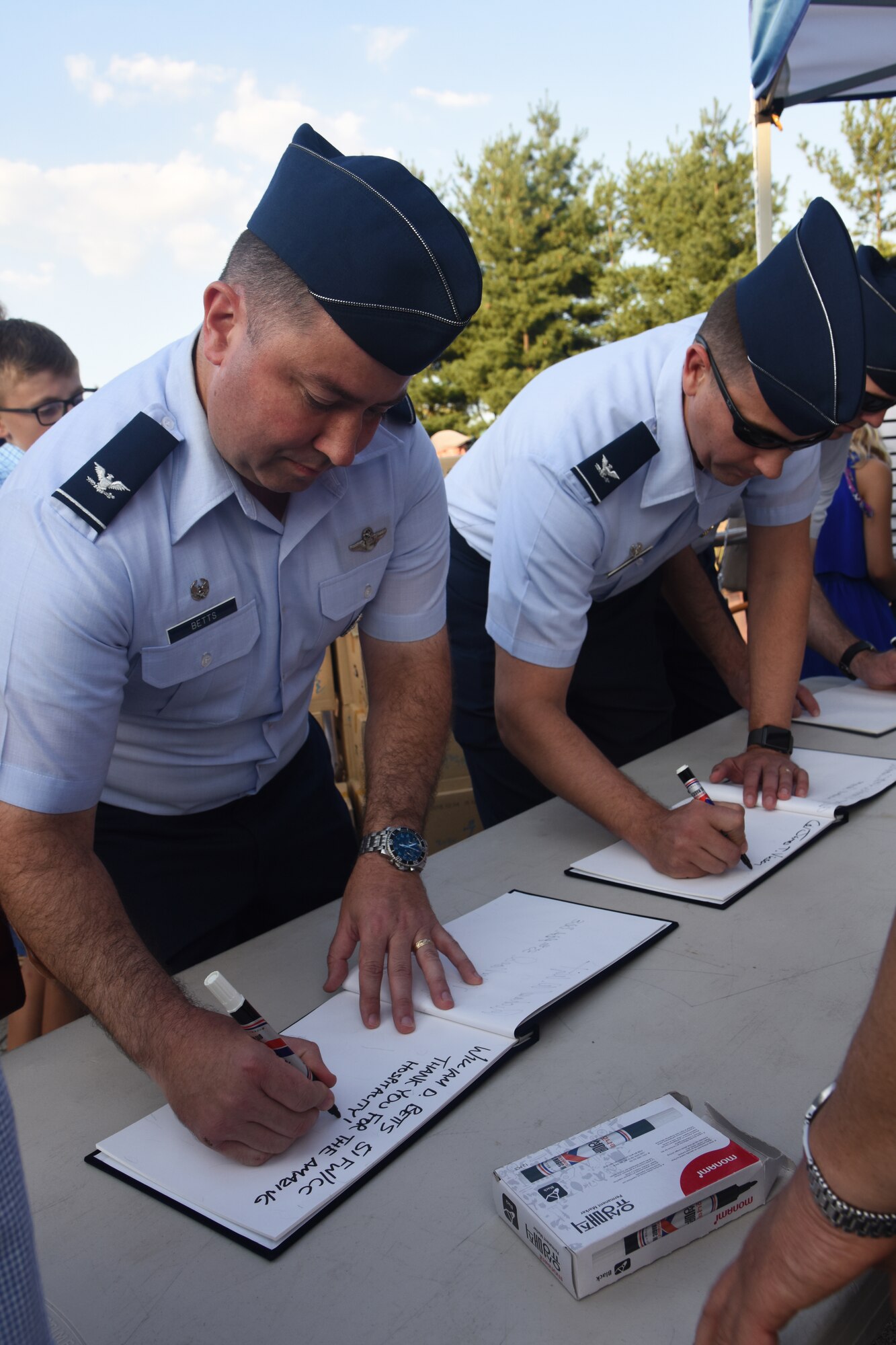 U.S. Air Force Col. William Betts, 51st Fighter Wing Commander, left, and Col. James Vinson, 51st Maintenance Group commander, sign the guest log before the opening ceremony of the 15th annual Korean-American Friendship Cultural Festival at the Songtan Entertainment District, Republic of Korea, Sept. 8, 2018. The festival features Korean folk plays, events and food along with U.S. military personnel residing in South Korea. (U.S. Air Force photo by Tech Sgt. Ashley Tyler)