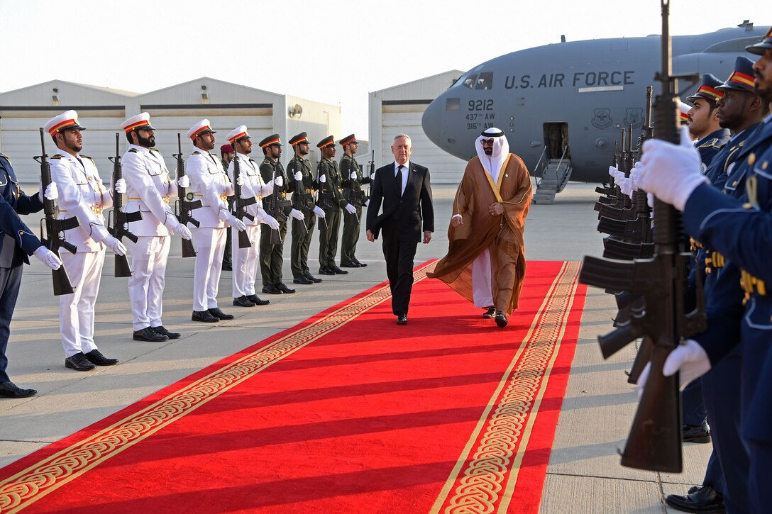 Defense Secretary James N. Mattis walks on a red carpet in United Arab Emirates.