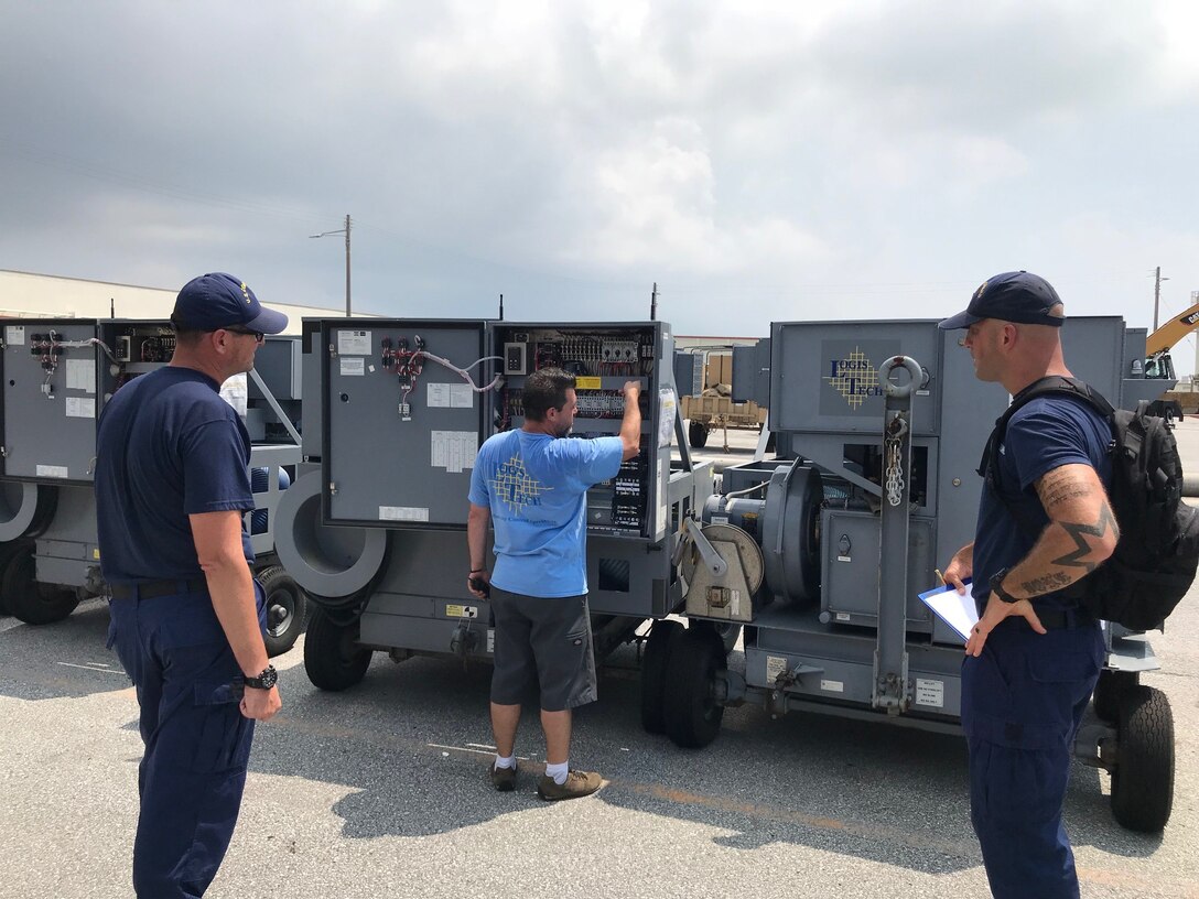 A Coast Guard forward inspection team screens the items before they are approved for shipment.