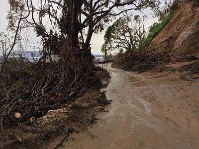 Washington Air National Guard member Master Sgt. Richard Dessert travels the treacherous roads near Utuado, Puerto Rico, in order to deliver Hurricane Maria relief supplies Oct. 5, 2017. Southeastern U.S. states are preparing for Hurricane Florence.