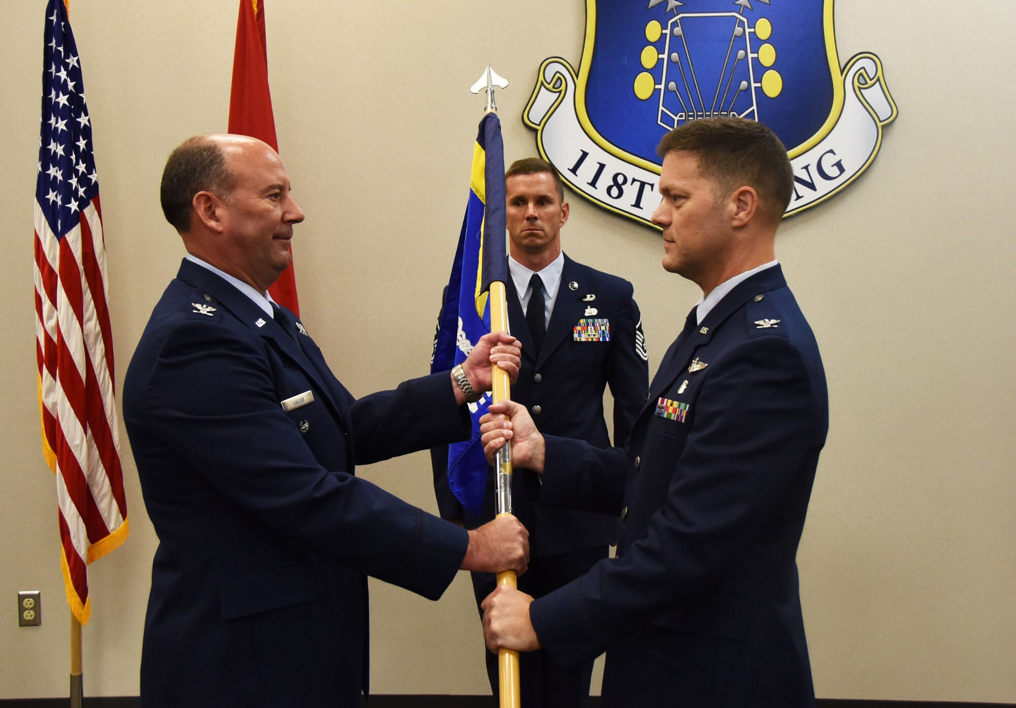 Col. Peter Geleskie, flight surgeon for the 118th Medical Group, receives the group’s guide-on flag from Col. James Hagar, vice commander of the 118th Wing, in a change of command ceremony on Sept. 9, 2018 at Berry Field Air National Guard Base, Nashville, Tennessee.