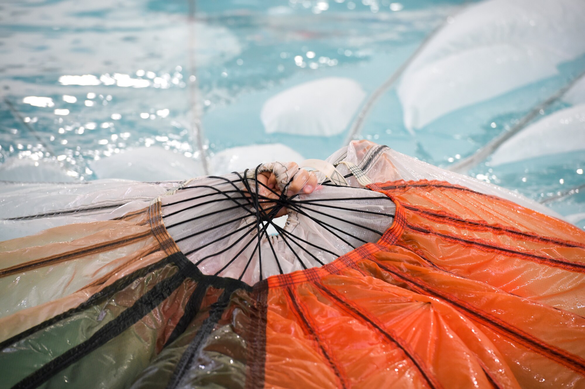 Reserve Citizen Airmen belonging to aircrews are required to know how to escape a parachute that is dragging them during emergency situations in open water.