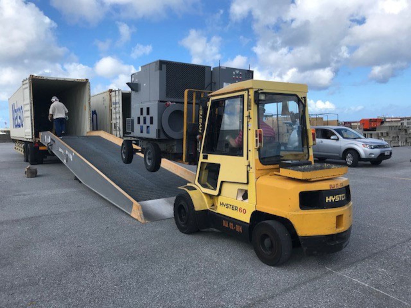 DLA Disposition Services employees provide the loading support to move the items into the shipping containers.