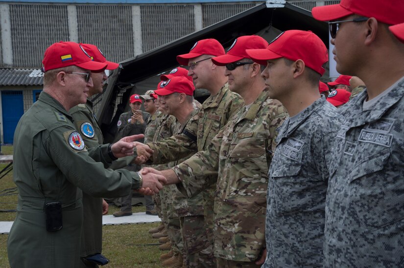 Colombian Air Force Major Gen. Rodrigo Alejandro Valencia Guevara, shakes hands with U.S. Air Force participants of the Colombian-led search and rescue exercise, Angel de los Andes, at Air Combat Command number 5 at Arturo Lema Posada Air Base in Rionegro, Colombia, Sept. 3, 2018. This is the second time the Colombian Air Force is hosting Angel de los Andes, the first was in 2015. Two U.S. Air Force aircraft and more than 90 U.S. Airmen are participating in the international exercise with 11 other nations.