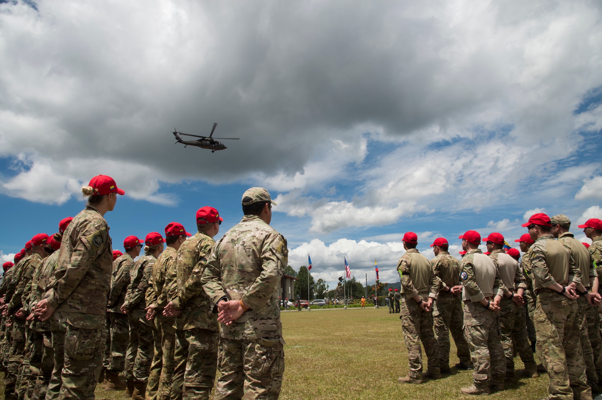 U.S. Air Force Airmen stand in a formation during the opening ceremony of the Colombian led search and rescue exercise, Angel de los Andes, at Air Combat Command number 5 at Arturo Lema Posada Air Base in Rionegro, Colombia, Sept. 3, 2018.
