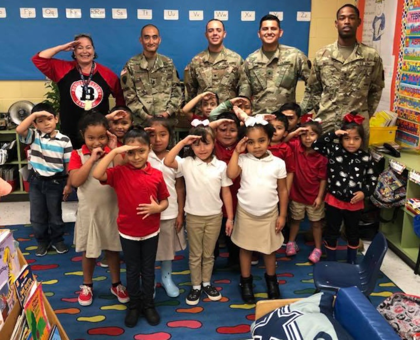 Theresa Mayfield's second-grade class salutes the Soldiers after their visit.