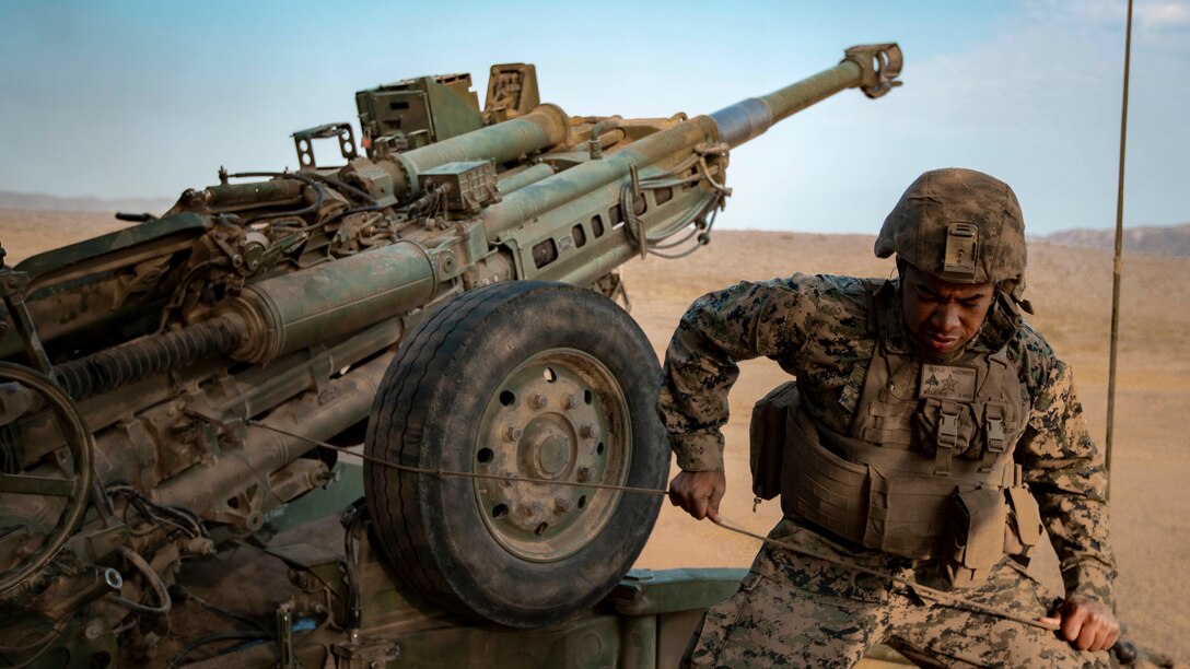 U.S. Marine Corps Cpl. Wilson Kelly, a field artillery cannoneer with 1st Battalion, 1st Marine Regiment, 1st Marine Division fires an M777 towed 155mm Howitzer during the regimental phase of SUMMER FIREX 2018, Aug. 10, 2018.