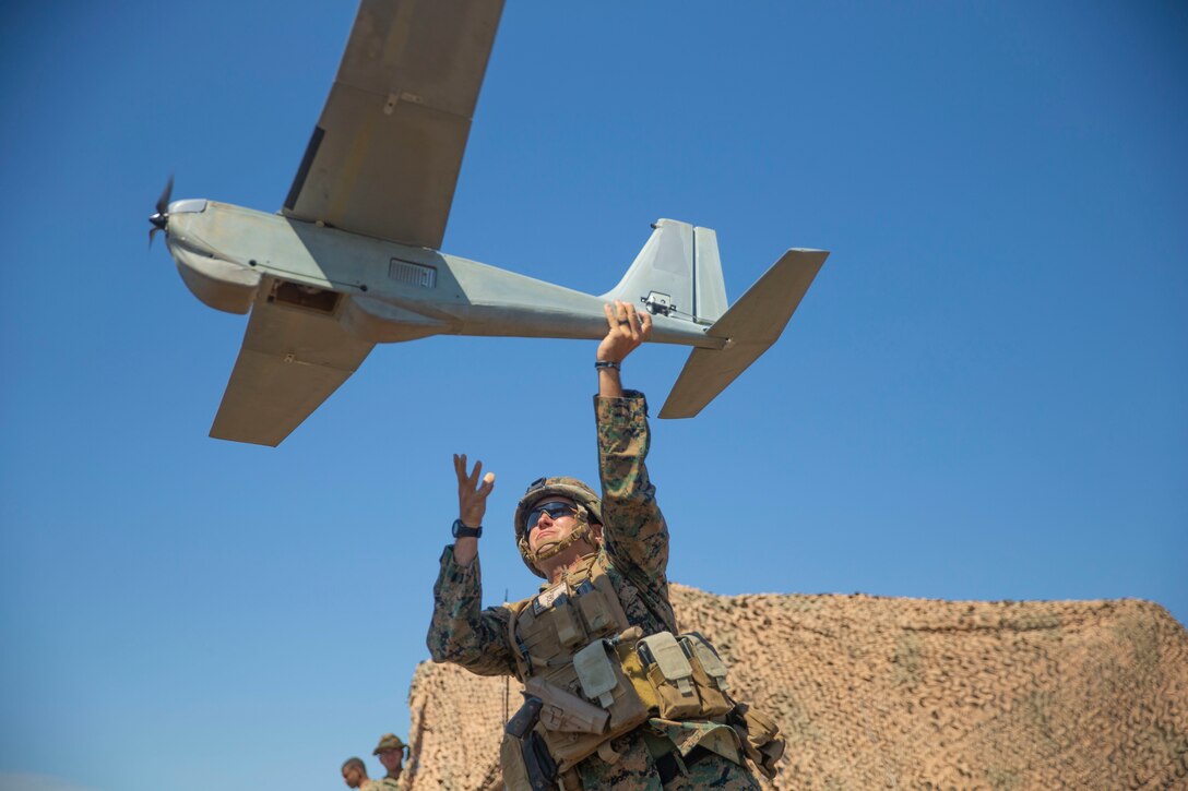 U.S. Marine Corps 1st Lt. Christopher Banks, the executive officer for Hotel Battery, 3rd Low Altitude Air Defense Battalion, 3rd Marine Aircraft Wing, deploys a RQ-20 Puma a small unmanned aircraft system during SUMMER FIREX 2018 at Marine Corps Base Camp Pendleton, Calif., Aug. 8, 2018.