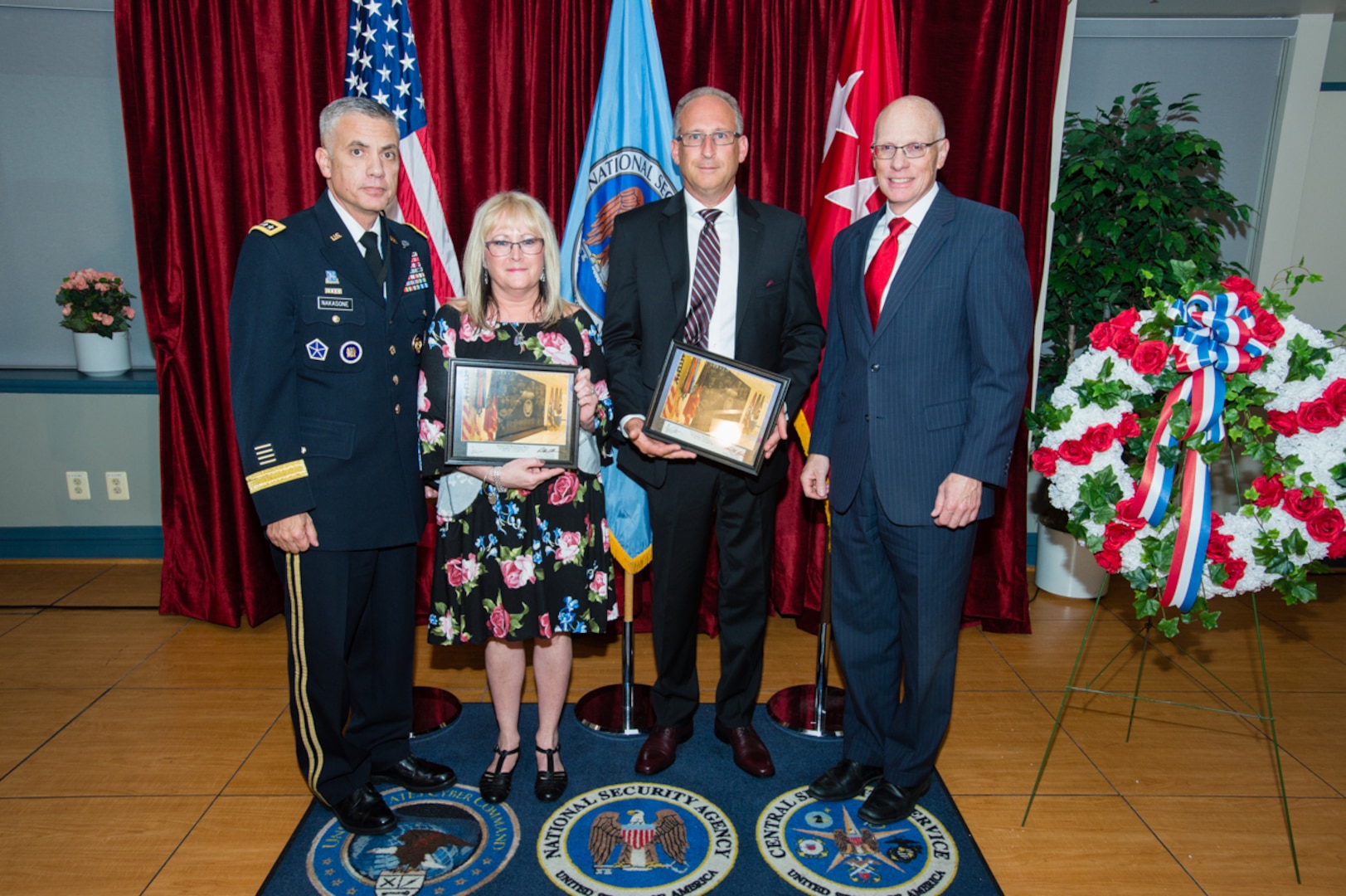 The Cavanaugh and Mitchell families receive a memento honoring Sgt. Townsend from General Paul M. Nakasone, Director  National Security Agency, and George C. Barnes, Deputy Director  National Security Agency.