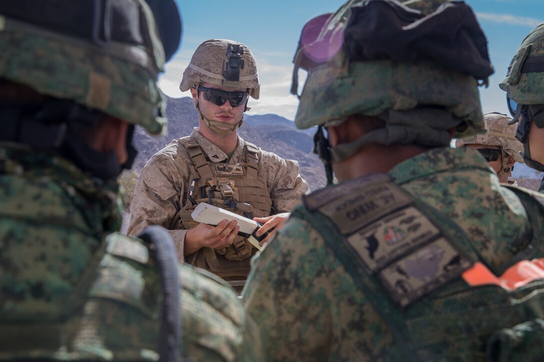 U.S. Marine Corps LCpl. Jacob Thomas, a combat engineer with 1st Combat Engineer Battalion, teaches a class on an Expedient Bangalore to Soldiers from Singapore Armed Forces during exercise Valiant Mark 2018 at Marine Corps Air-Ground Combat Center Twentynine Palms, Calif. Aug. 28, 2018.