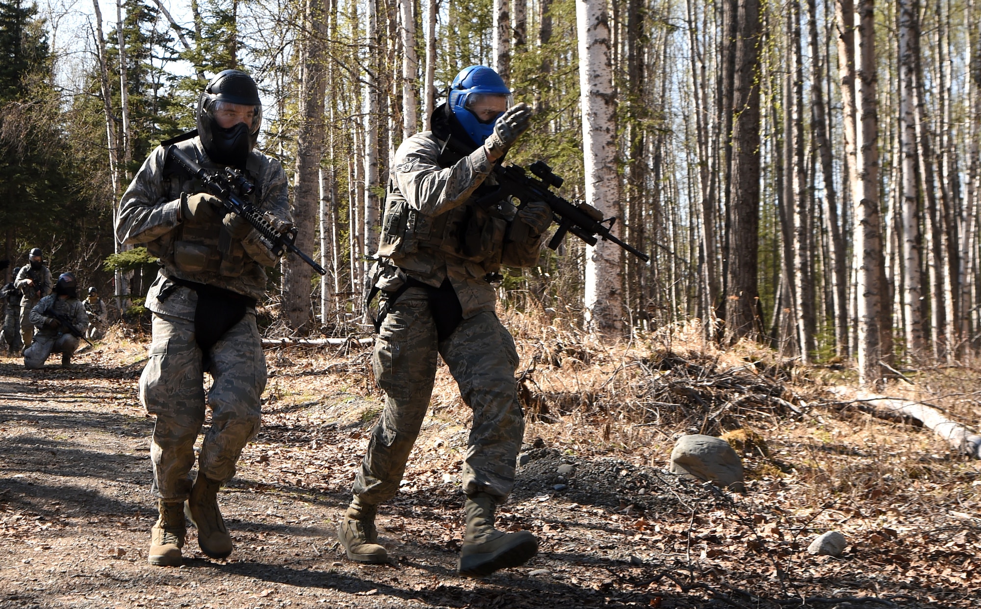 Airmen 1st Class Mathew Rozean (left) and Theodore Dykstra, 673rd Security Forces Squadron, participate in training at Joint Base Elmendorf-Richardson, Alaska, May 4, 2015. A new Air Force medical unit called an Operational Support Team is embedded with the base guard squadron to improve unit health and readiness by studying and addressing issues specific to the squadron. (U.S. Air Force photo by Staff Sgt. Sheila deVera)