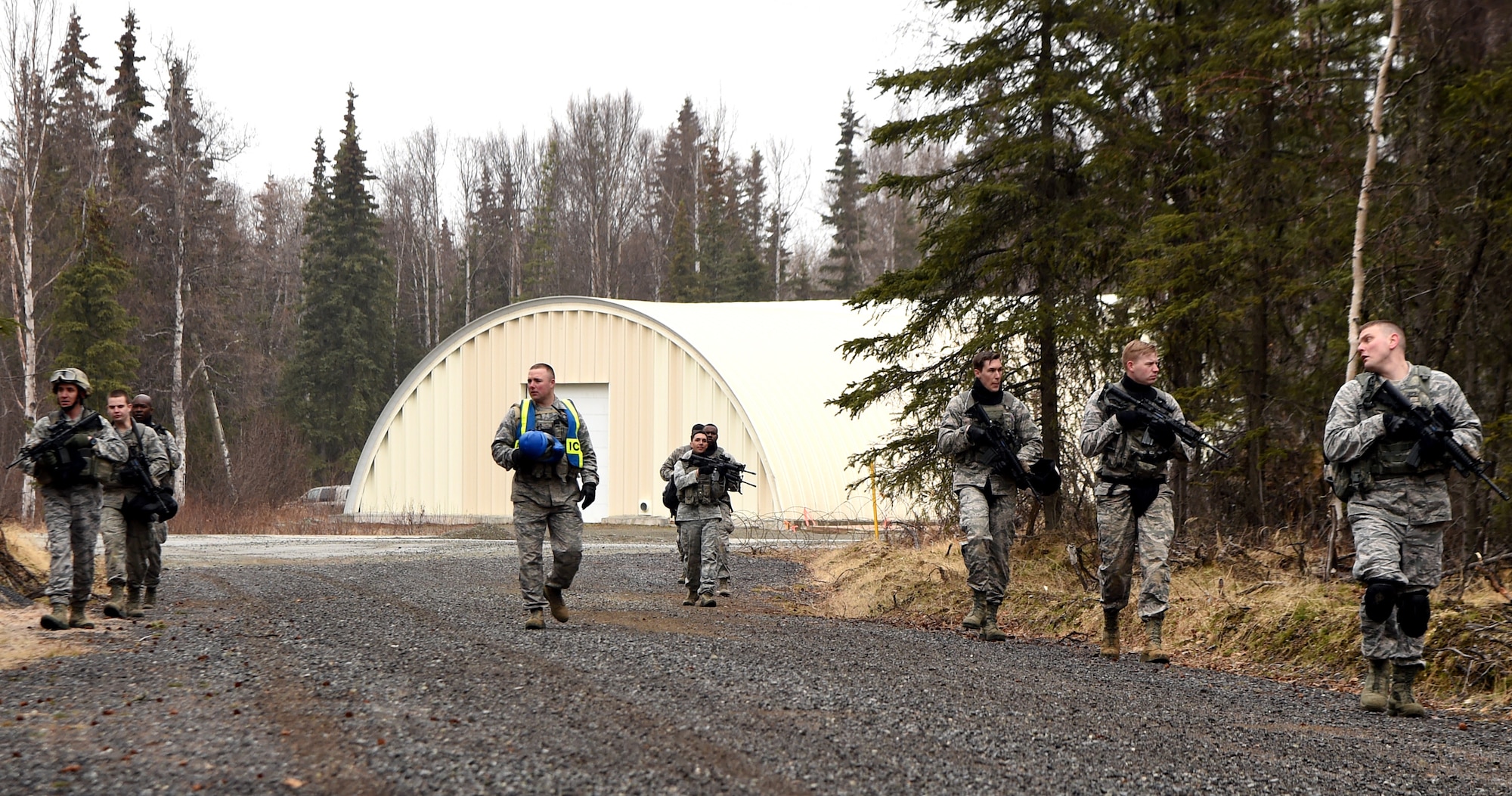 Members of the 673rd Security Forces Squadron during a training exercise at Joint Base Elmendorf-Richardson, Alaska, April 27, 2015. A new Air Force medical unit called an Operational Support Team is embedded with the base guard squadron to improve unit health and readiness by studying and addressing issues specific to the squadron. (U.S. Air Force photo by Staff Sgt. Sheila deVera)