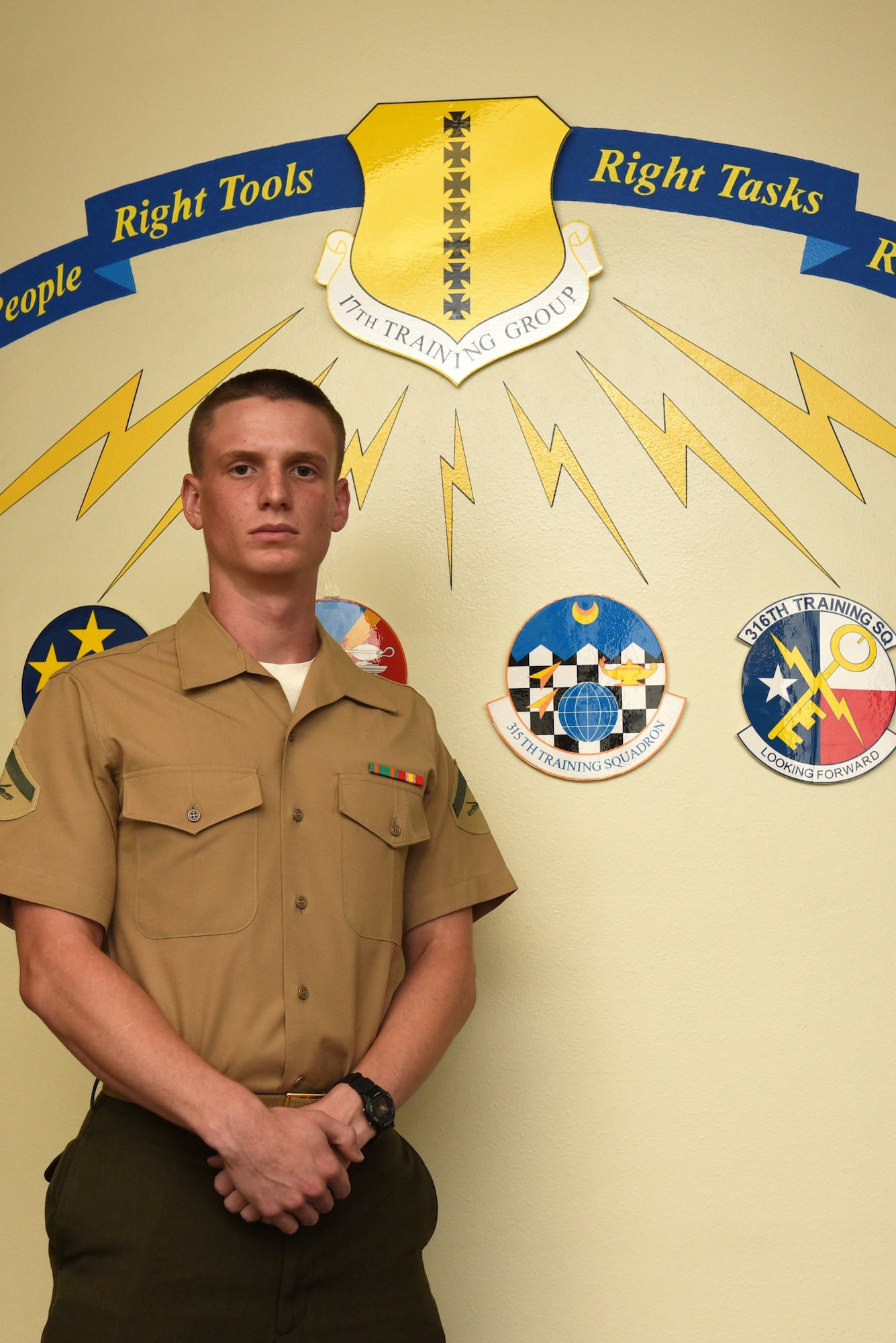 U.S. Marine Corps Lance Cpl. Isaiah Gray, Marine Corps Detachment at Goodfellow student, stands in front of a mural at Brandenburg Hall on Goodfellow Air Force Base, Texas, Sept. 7, 2018. Gray is the Goodfellow Student of the Month spotlight for August 2018, a series highlighting Goodfellow students. (U.S. Air Force photo by Staff Sgt. Joshua Edwards/Released)