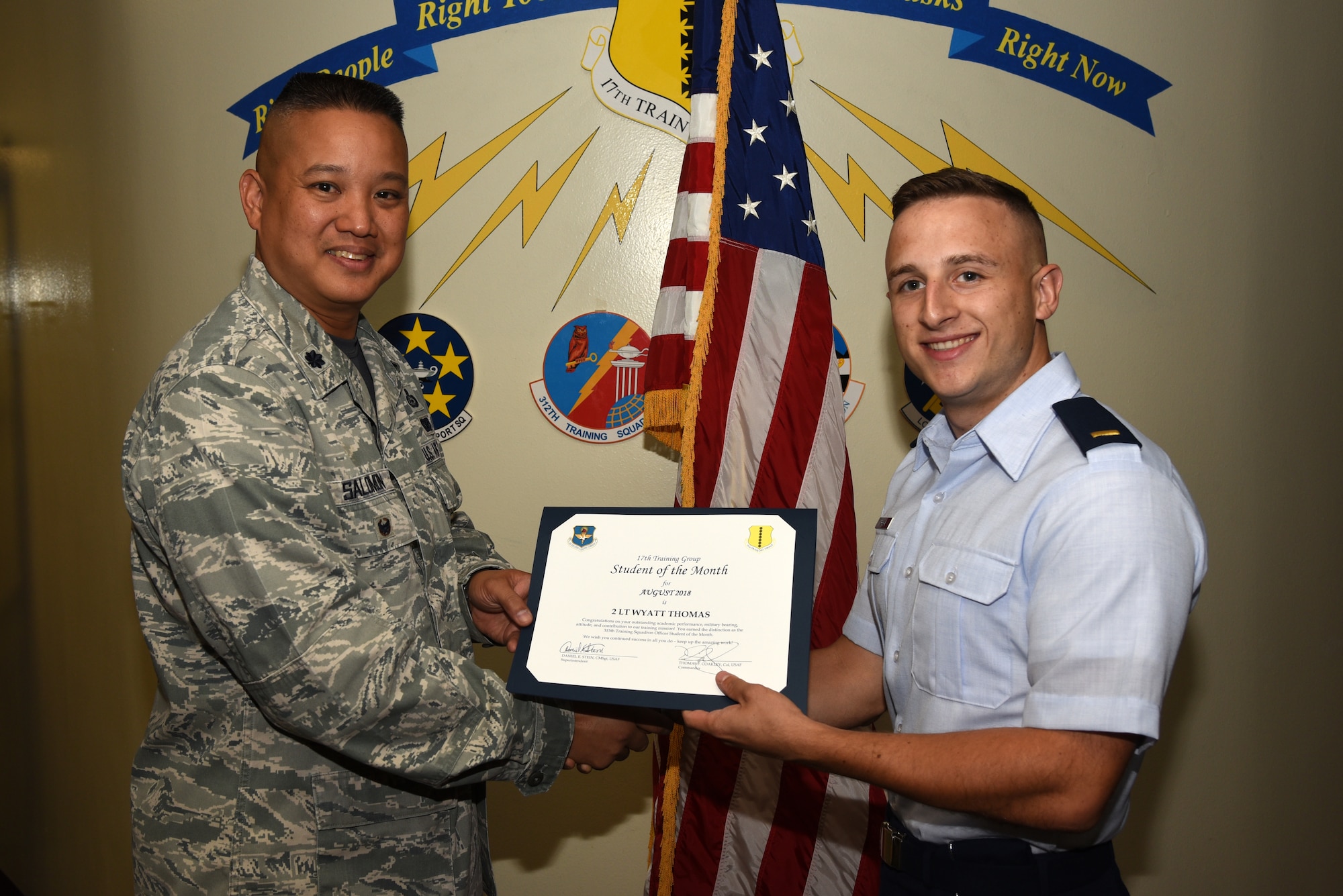U.S. Air Force Lt. Col. Abraham Salomon, 17th Training Group deputy commander, presents the 315th Training Squadron Officer Student of the Month award to 2nd Lt. Wyatt Thomas, 315th TRS student, at Brandenburg Hall on Goodfellow Air Force Base, Texas, Sept. 7, 2018. The 315th TRS’s vision is to develop combat-ready intelligence, surveillance and reconnaissance professionals and promote an innovative squadron culture and identity unmatched across the U.S. Air Force. (U.S. Air Force photo by Staff Sgt. Joshua Edwards/Released)