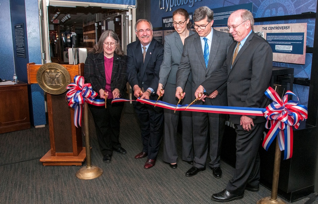Cutting the ribbon to the "William Friedman: A Life in Cryptology" exhibit are (l-r) Mrs. Betsy Rohaly Smoot â CCH Historian; Mr. Richard Schaeffer - President of the National Cryptologic Museum Foundation; Ms. Corin Stone - NSA Executive Director; Mr. Jonathan Freed - NSA Associate Director for Strategic Communications; and Dr. David Sherman - NSA Associate Director for Policy and Records.