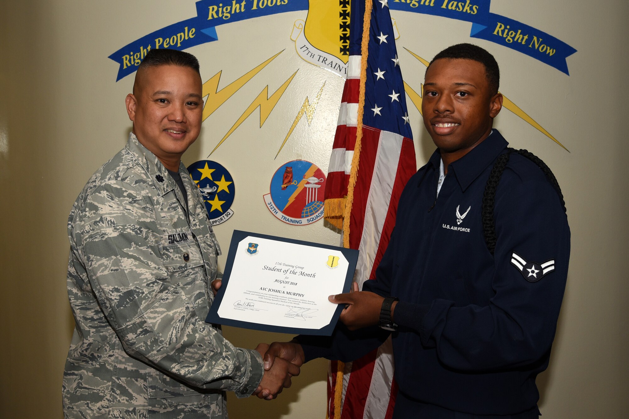U.S. Air Force Lt. Col. Abraham Salomon, 17th Training Group deputy commander, presents the 315th Training Squadron Student of the Month award to Airman 1st Class Joshua Murphy, 315th TRS student, at Brandenburg Hall on Goodfellow Air Force Base, Texas, Sept. 7, 2018. The 315th TRS’s vision is to develop combat-ready intelligence, surveillance and reconnaissance professionals and promote an innovative squadron culture and identity unmatched across the U.S. Air Force. (U.S. Air Force photo by Staff Sgt. Joshua Edwards/Released)