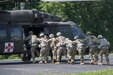 FORT KNOX, Ky. – Soldiers from the 1st Theater Sustainment Command (TSC) board onto a HH-60M Hospital Blackhawk during an air medical evacuation (MEDEVAC) training, July 12. The 1st TSC Soldiers learned how to build and use a Single Channel Ground and Airborne Radio System, evaluate a casualty and perform tactical care, request MEDEVAC support and aircraft safety as well as tactical aerial flight operations. (U.S. Army photos by Mr. Brent Thacker)