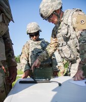 FORT KNOX, Ky. – 1st Theater Sustainment Command Soldiers learn how to put together a Single Channel Ground and Airborne Radio System (SINCGARS), July 12. Upon completing the SINCGARS, the Soldiers are able to call for a 9-Line air medical evacuation request. (U.S. Army photos by Mr. Brent Thacker)