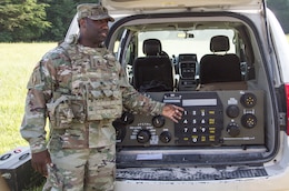 FORT KNOX, Ky. – Sgt. 1st Class Lonnie Clopton, network assurance noncommissioned officer in charge, 1st Theater Sustainment Command, teaches Soldiers how to use a Single Channel Ground and Airborne Radio System (SINCGARS), July 12. Upon completing the SINCGARS, the Soldiers are able to call for a 9-Line air medical evacuation request. (U.S. Army photos by Mr. Brent Thacker)