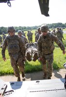 FORT KNOX, Ky. – 1st Theater Sustainment Command (TSC) Soldiers conduct a litter carry onto a HH-60M Hospital Blackhawk during an air medical evacuation (MEDEVAC) training, July 12. The 1st TSC Soldiers learned how to build and use a Single Channel Ground and Airborne Radio System, evaluate a casualty and perform tactical care, request MEDEVAC support and aircraft safety as well as tactical aerial flight operations. (U.S. Army photos by Mr. Brent Thacker)