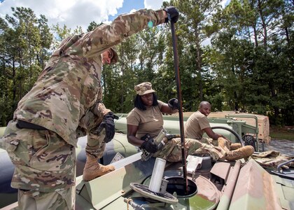 South Carolina National Guard Soldiers from the 118th Forward Support Company transfer bulk diesel fuel into M987 HEMTT fuel tanker trucks for distribution in preparation to support partnered civilian agencies and safeguard the citizens of the state in advance of Hurricane Florence, Sept. 10, 2018.  Approximately 800 Soldiers and Airmen have been mobilized  to prepare, respond and participate in recovery efforts as forecasters project Hurricane Florence will increase in strength.