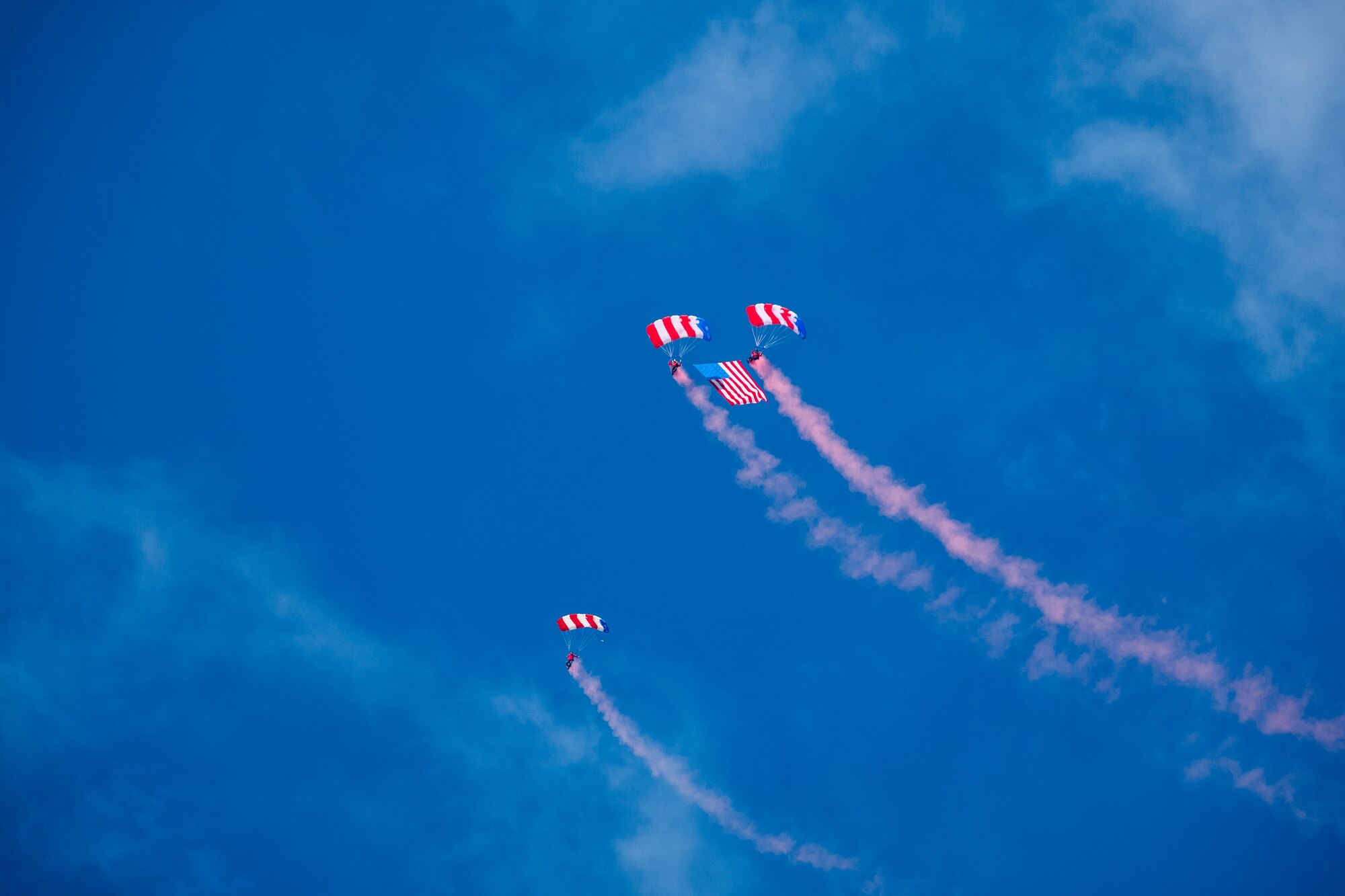 The Patriot Parachute Team glides over spectators at the Frontiers in Flight Open House and Airshow Sept. 9, 2018, McConnell Air Force Base, Kan. Veteran owned and operated, the Patriot Parachute Team’s mission is to inspire the next generation of patriots and to raise awareness for various Veteran causes. (U.S. Air Force Photo by Staff Sgt. Preston Webb)