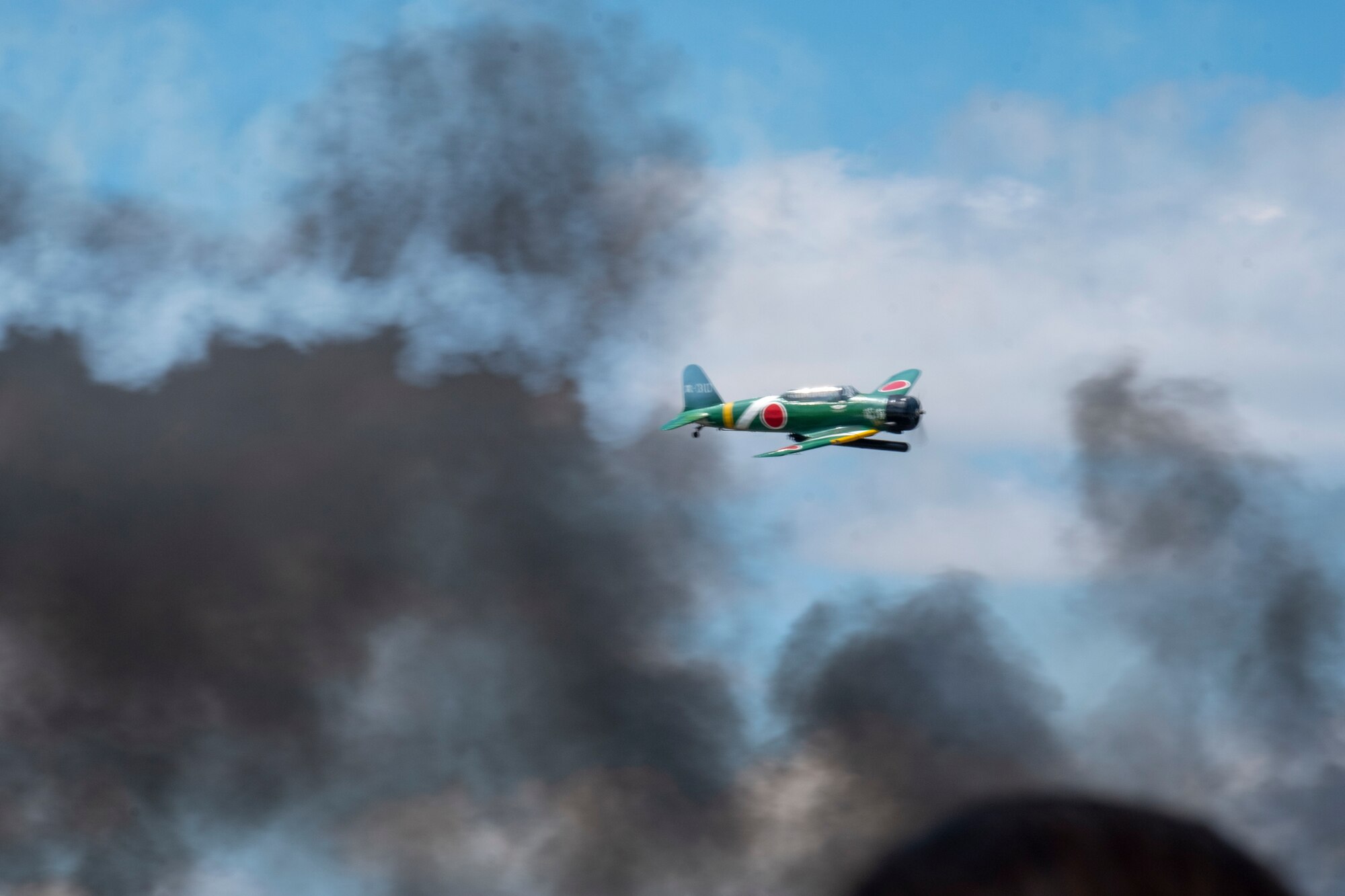 The “Tora! Tora! Tora!”  team re-enacts the attack on Pearl Harbor at the Frontiers in Flight Open House and Airshow Sept. 9, 2018, McConnell Air Force Base, Kan. The crew have been performing the act for 46 years in an effort to honor the men and women that lost their lives during the attack. (U.S. Air Force Photo by Staff Sgt. Preston Webb)