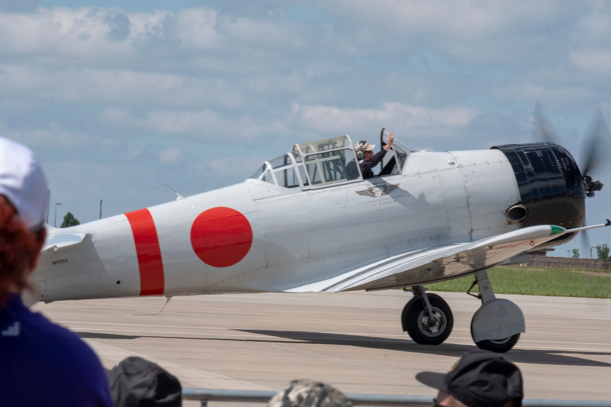 A member of the “Tora! Tora! Tora!” team prepares to re-enact the attack on Pearl Harbor at the Frontiers in Flight Open House and Airshow Sept. 9, 2018, McConnell Air Force Base, Kan. The crew have been performing the act for 46 years in an effort to honor the men and women that lost their lives during the attack. (U.S. Air Force Photo by Staff Sgt. Preston Webb)