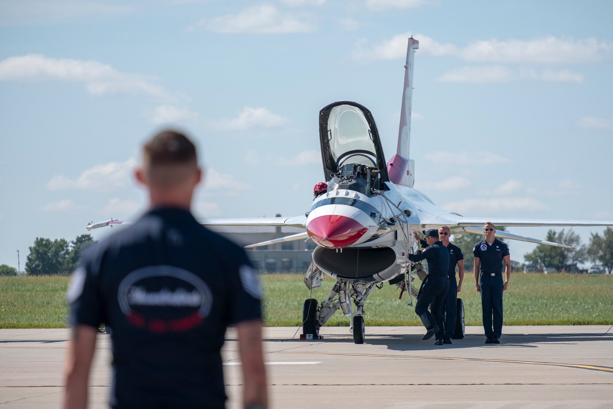 Members of the U.S. Thunderbirds prepare for a performance for Team McConnell at the Frontiers in Flight Open House and Airshow Sept. 9, 2018, McConnell Air Force Base, Kan. In 1953 the Air Force activated the 3600th Demonstration Unit, which adopted the name “Thunderbirds,” establishing a 55-year heritage of displaying the capabilities of the most powerful Air Force in the world. (U.S. Air Force Photo by Staff Sgt. Preston Webb)