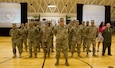 FORT KNOX, Ky. – Soldiers and civilians from the 1st Theater Sustainment Command stand at parade rest during the White Team Redeployment Ceremony at the Sadowski Center, June 20. The team deployed to Kuwait in December and spent six-months there, traveling to various countries in the Middle East, in support of their mission. (U.S. Army photo by Mr. Brent Thacker)