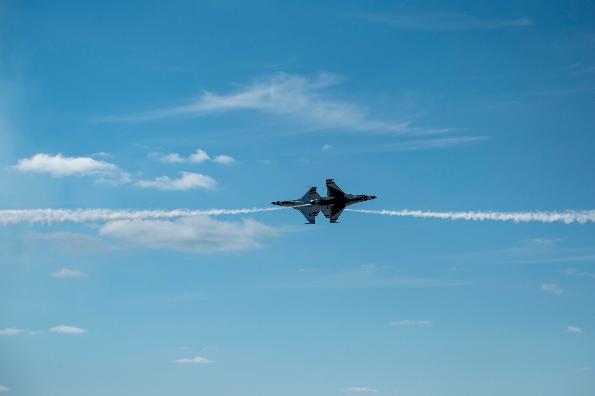 Members of the U.S. Thunderbirds perform for Team McConnell at the Frontiers in Flight Open House and Airshow Sept. 9, 2018, McConnell Air Force Base, Kan. In 1953 the Air Force activated the 3600th Demonstration Unit, which adopted the name “Thunderbirds,” establishing a 55-year heritage of displaying the capabilities of the most powerful Air Force in the world. (U.S. Air Force Photo by Staff Sgt. Preston Webb)